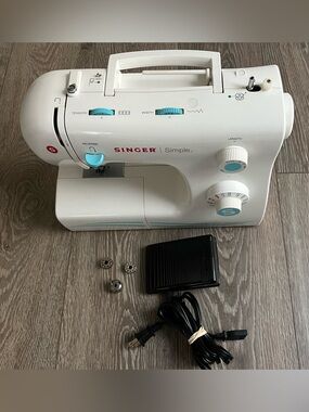 Singer Simple Compact Sewing Machine - White with Aqua Accents Conditions